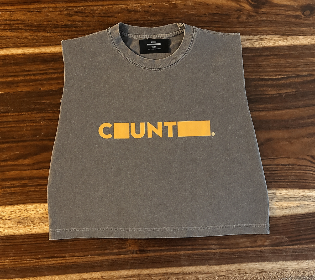 COUNTRY REDACTED™ 001.5            IN MIGRATION                             Washed Charcoal / Gold Muscle Tee